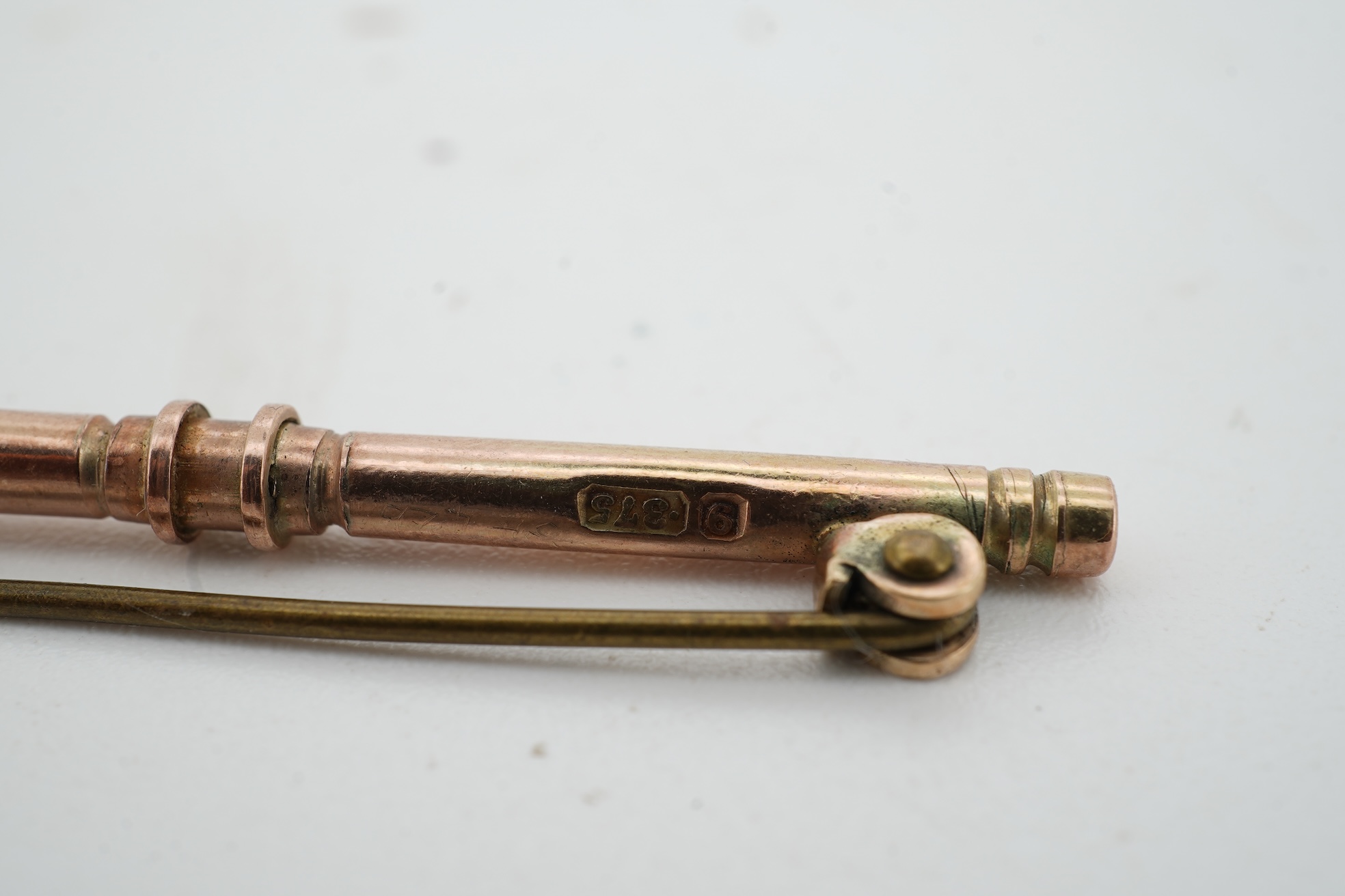 A pair of 18ct gold cufflinks, each end of oval outline, connected by chain linking, engraved with the initials RWA, length 1.8cm each, British hallmarks, combined gross weight approximately 7.5 grams